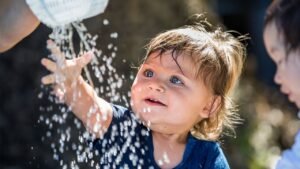 Child Playing With Water